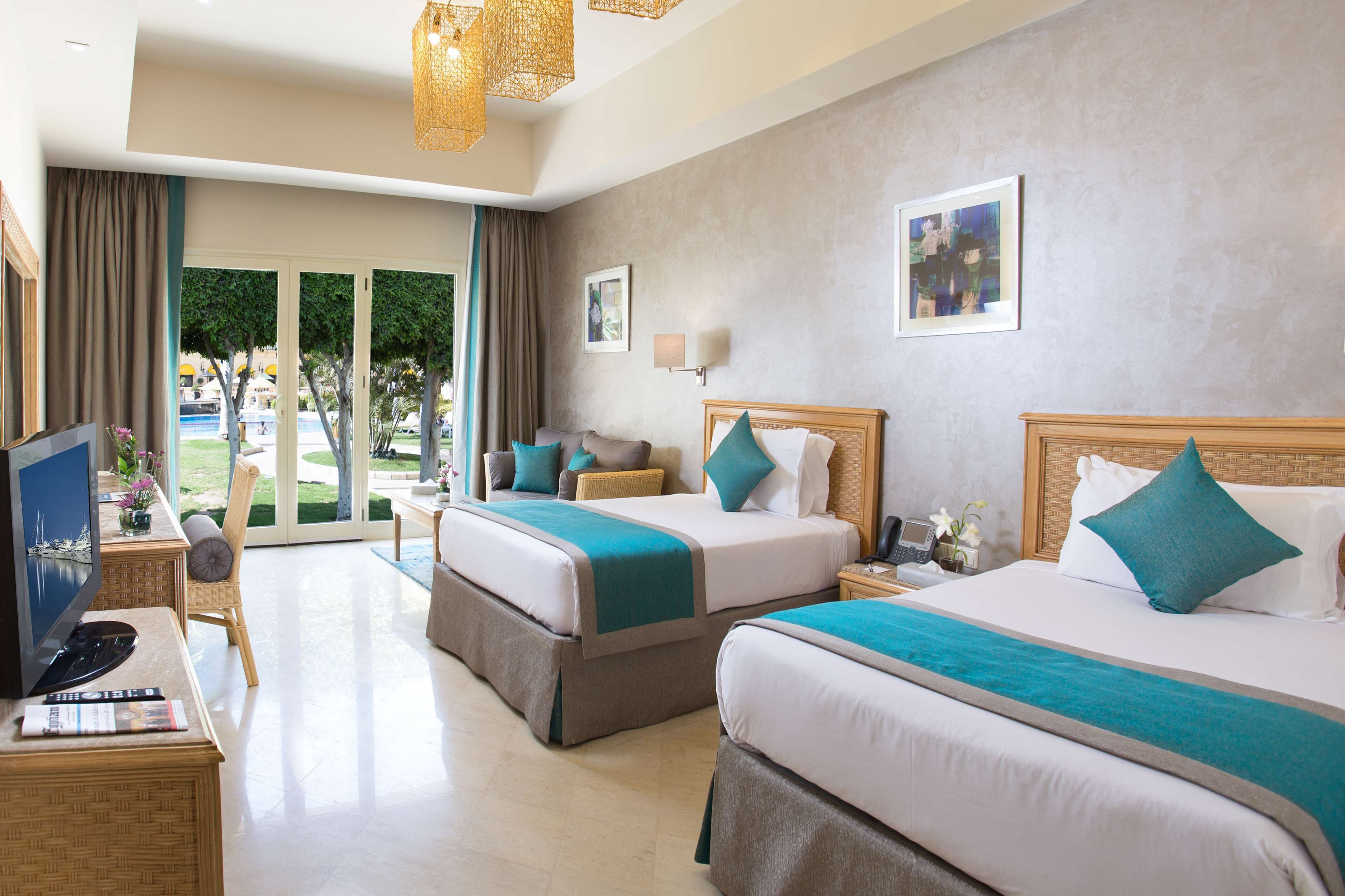 superior room, pool view | minibar, in-room safe, individually decorated, individually furnished