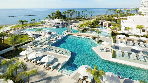 A resort with multiple swimming pools, sun loungers, and palm trees. - Parklane, a Luxury Collection Resort & Spa, Limassol (Limassol)
