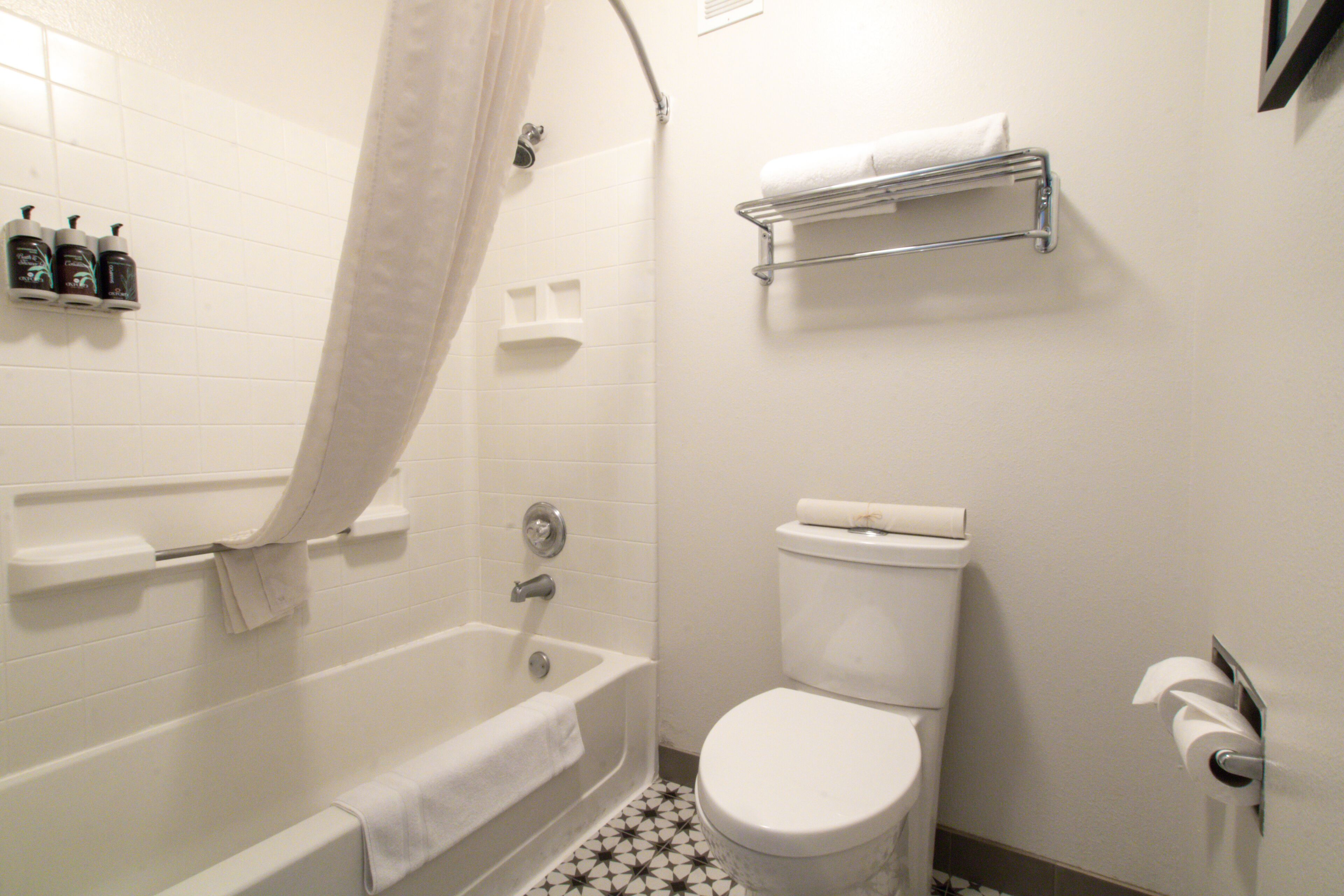 two room family suite 2 king 2 bathroom sleeper sofa | bathroom | combined shower/bathtub, eco-friendly toiletries, hair dryer, towels