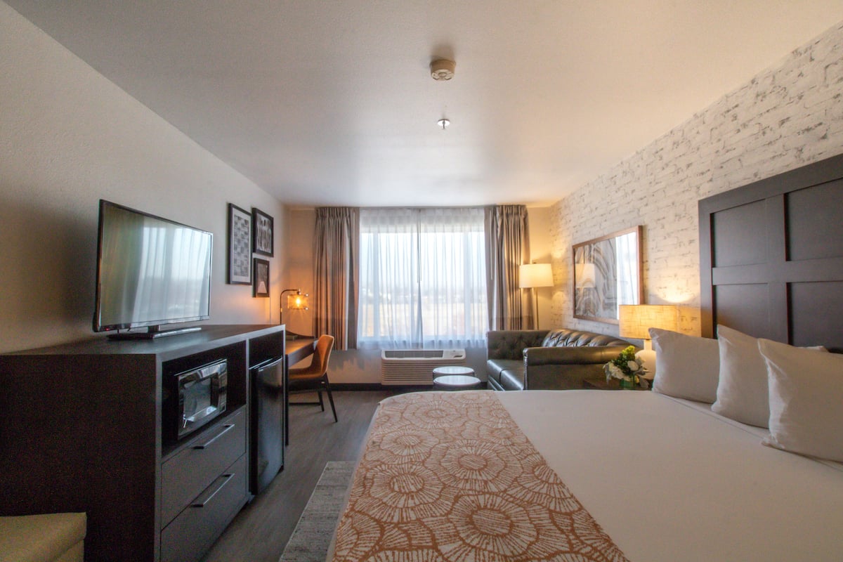 king suite sleeper sofa | premium bedding, blackout curtains, iron/ironing board