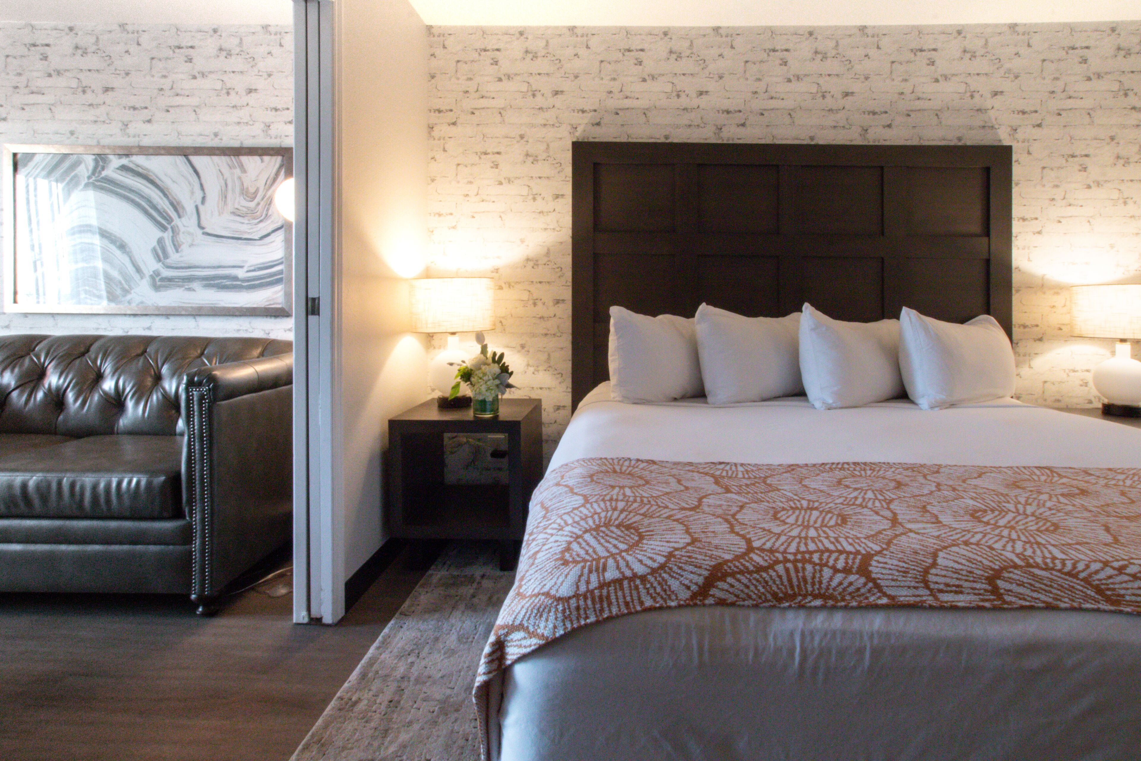 execrative king suite sleeper sofa | premium bedding, blackout curtains, iron/ironing board