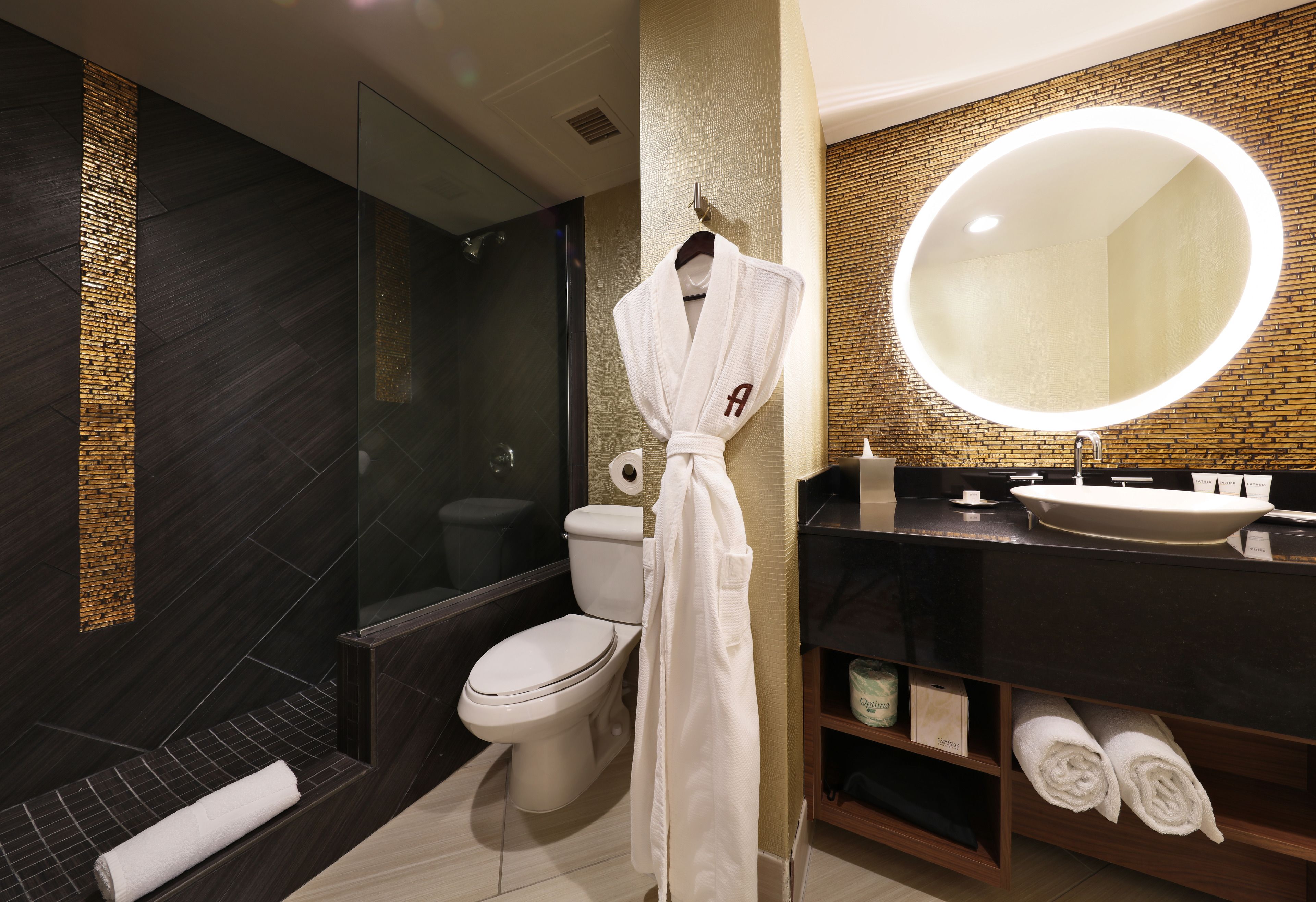 designer toiletries, hair dryer, towels, soap