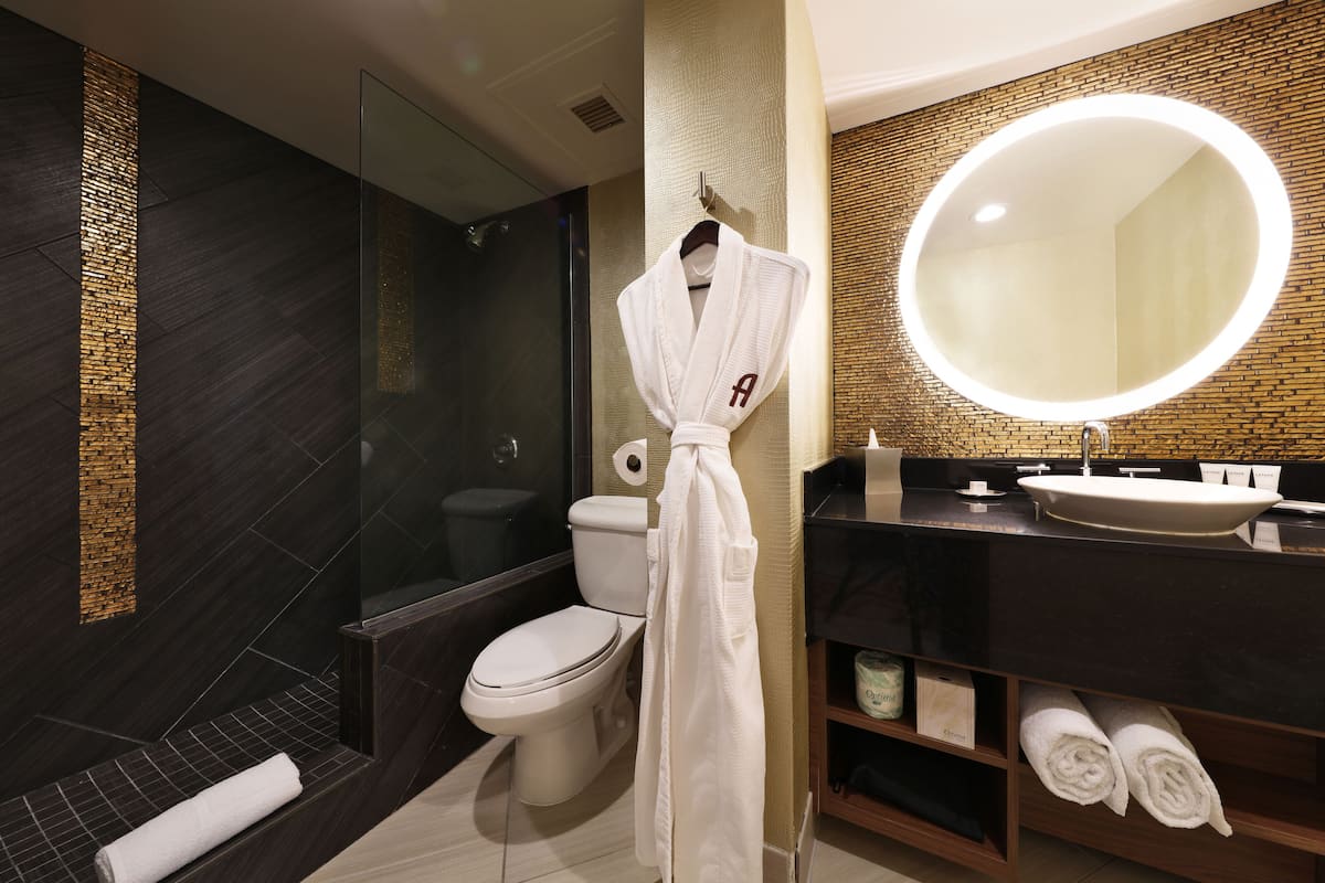 designer toiletries, hair dryer, towels, soap