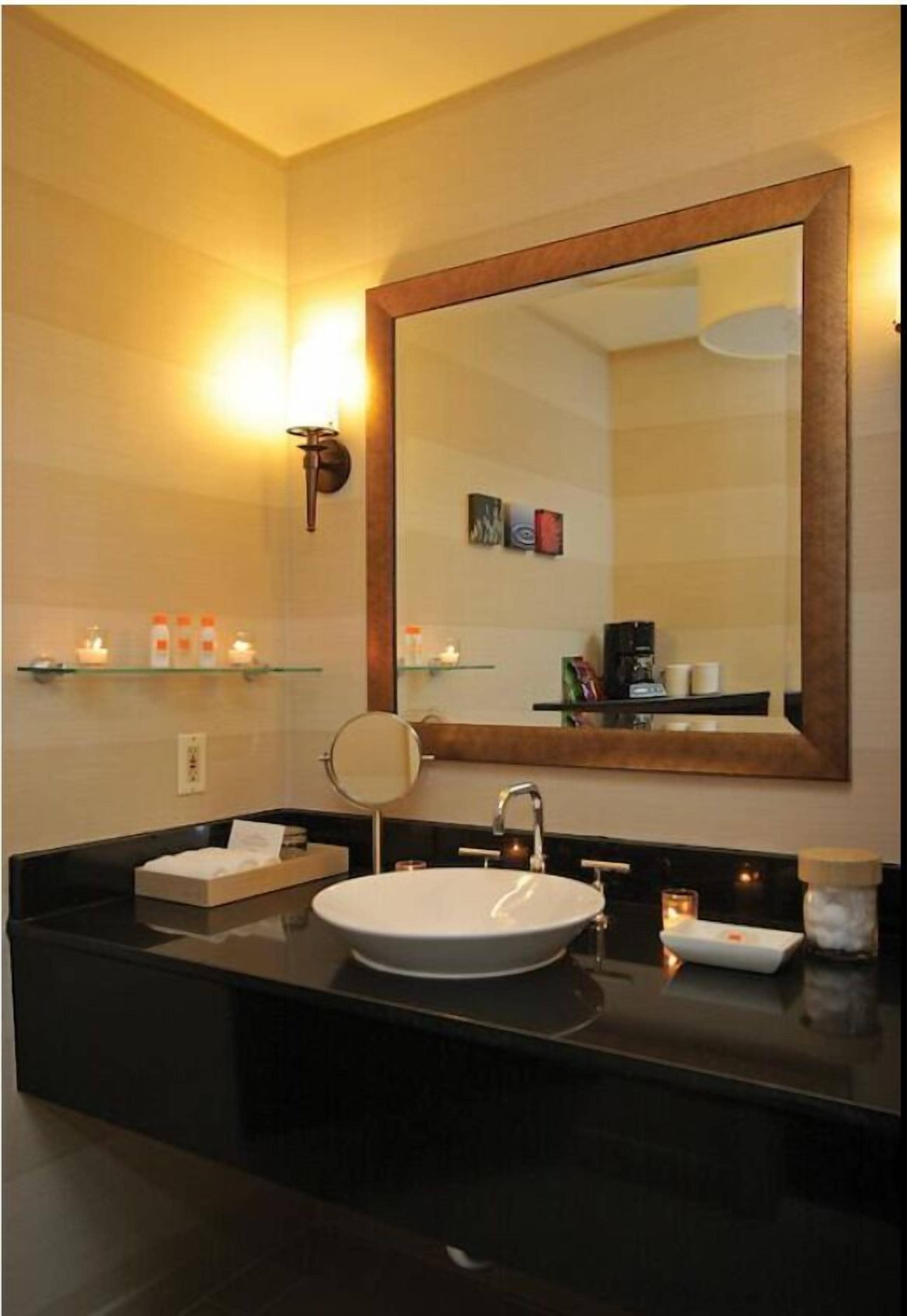 designer toiletries, hair dryer, towels, soap