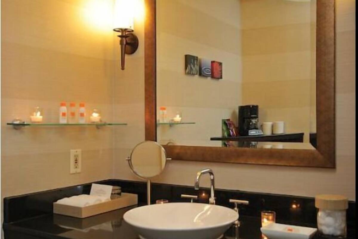 designer toiletries, hair dryer, towels, soap