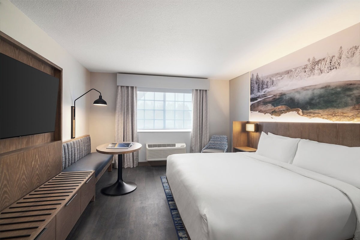 Premium bedding, pillow-top beds, laptop workspace, iron/ironing board