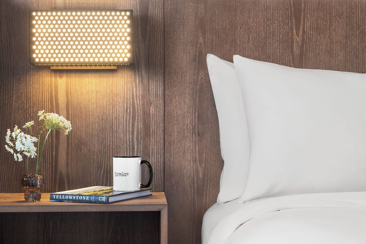 Premium bedding, pillow-top beds, laptop workspace, iron/ironing board