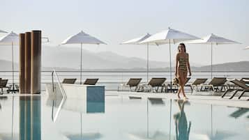 Outdoor pool, open 9:00 AM to 8:00 PM, pool umbrellas, pool loungers