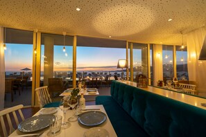 Breakfast, lunch, dinner served; local cuisine, pool views 