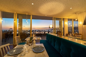 Breakfast, lunch, dinner served; local cuisine, pool views
