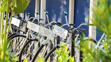 A row of bicycles with attached key cards for Fairfield Inn & Suites by Marriott.