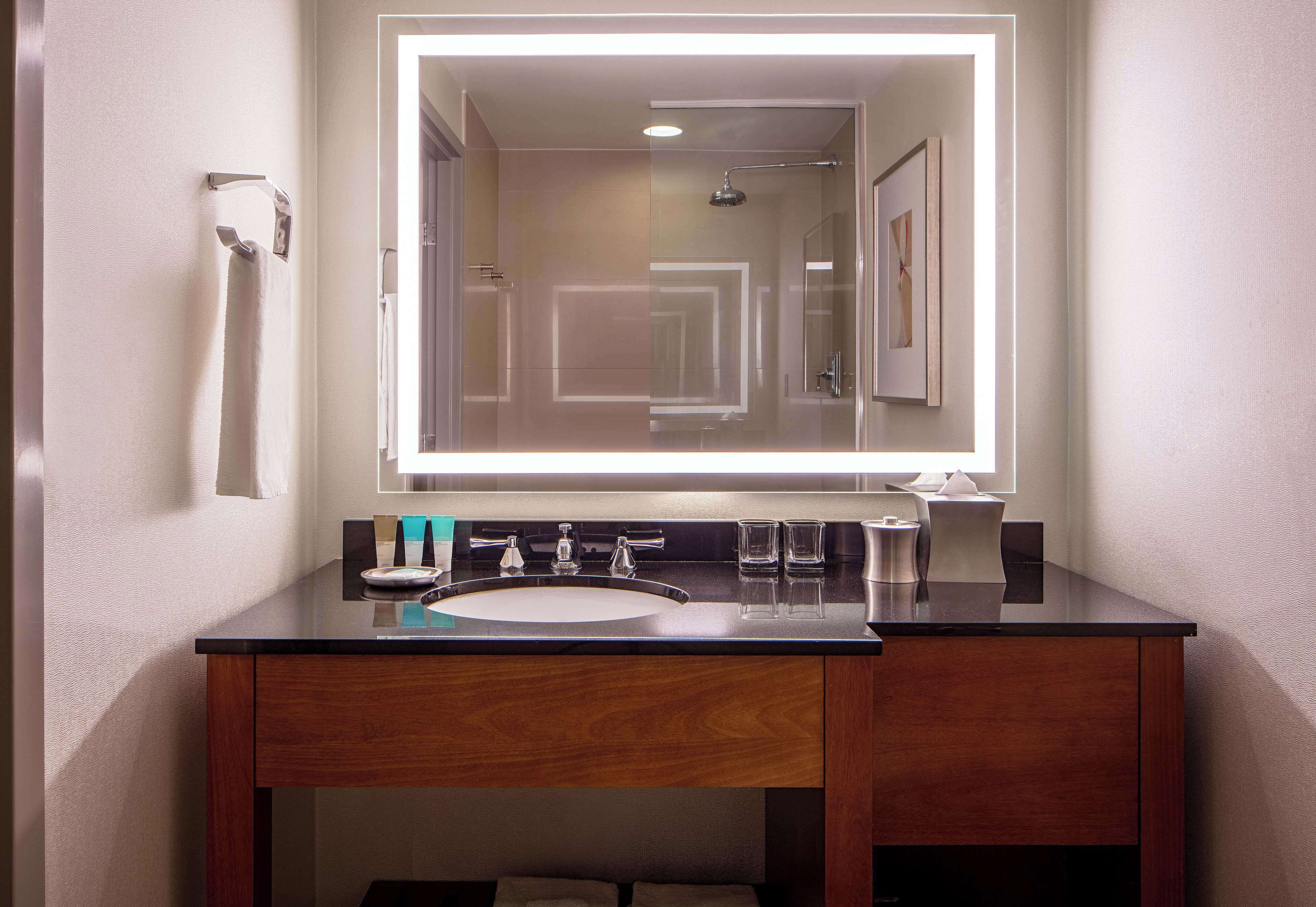 rainfall showerhead, designer toiletries, hair dryer, towels