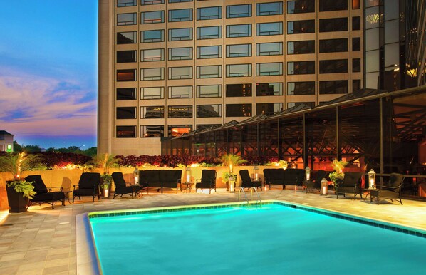 Seasonal outdoor pool, open 10:00 AM to 10:00 PM, pool loungers