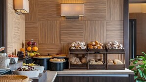 A breakfast buffet with various pastries, fruits, and desserts. - Grand Hotel Adriatico (Florence)