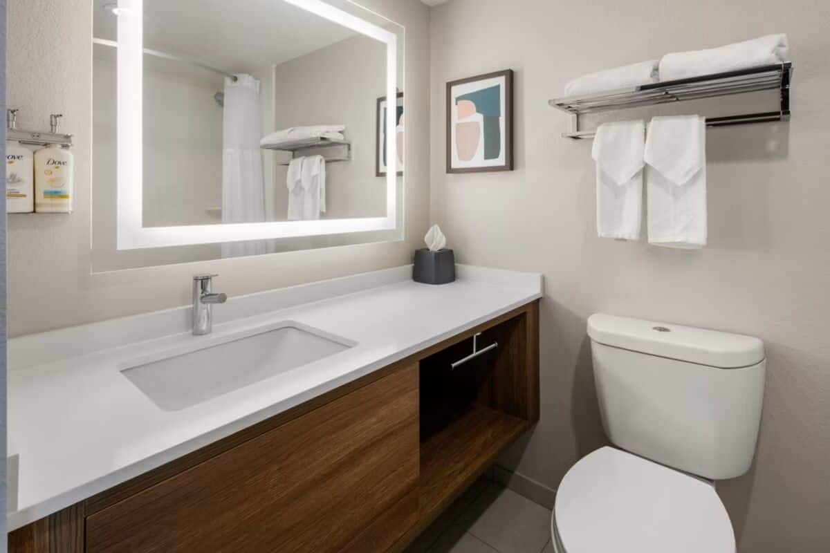 designer toiletries, hair dryer, towels, soap