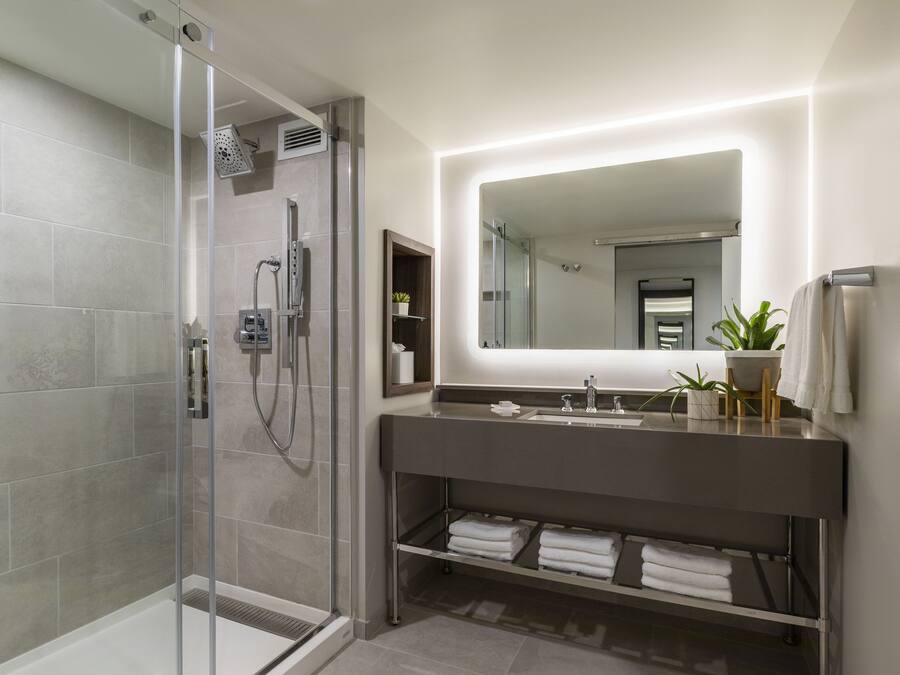 Shower, designer toiletries, hair dryer, bathrobes