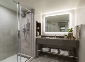 Shower, designer toiletries, hair dryer, bathrobes