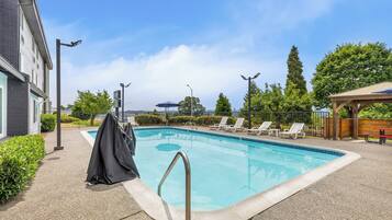 Seasonal outdoor pool, open 10 AM to 10 PM, pool umbrellas, sun loungers