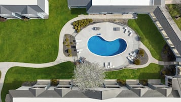 Seasonal outdoor pool, open 9:30 AM to 10:00 PM, pool umbrellas