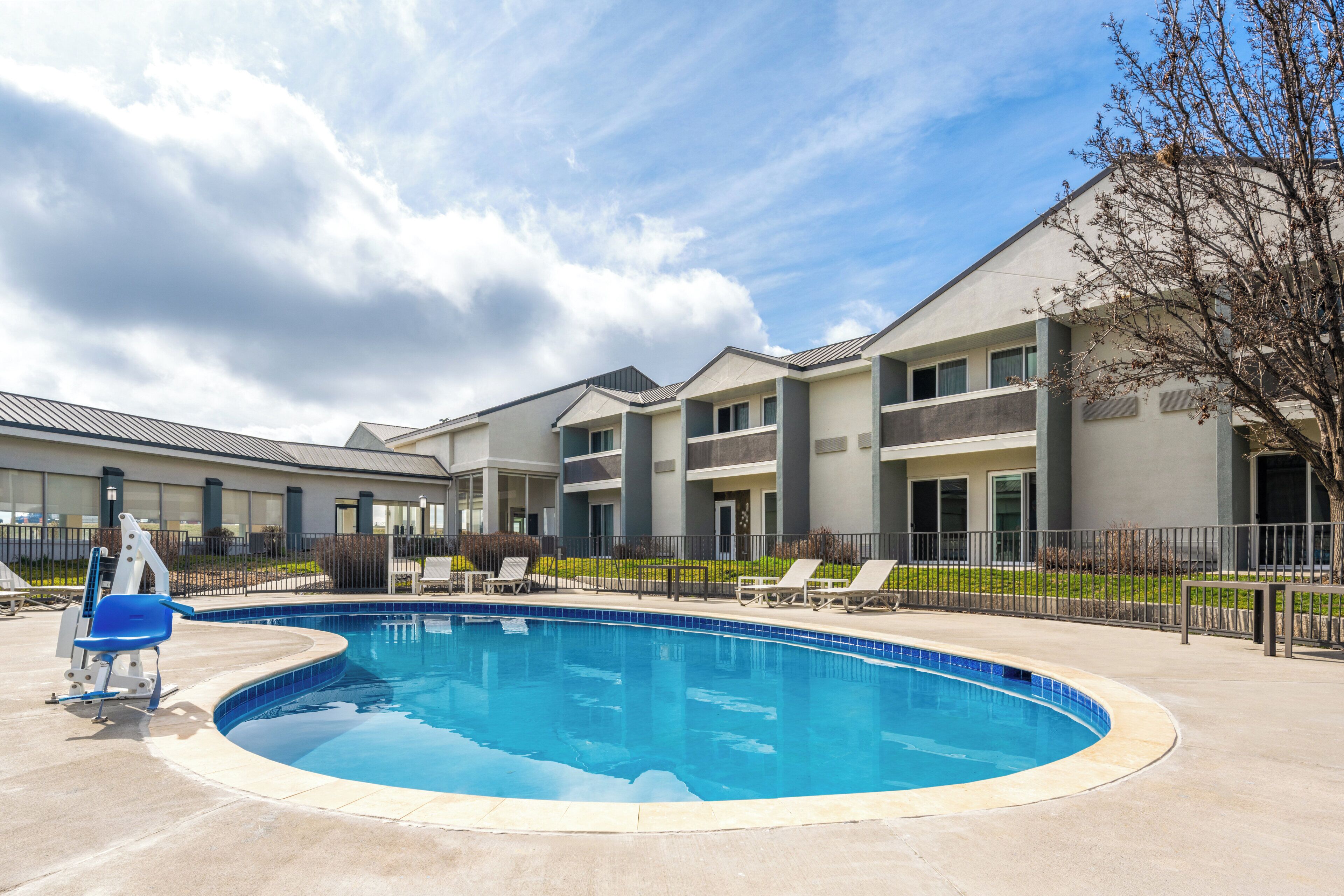 Seasonal outdoor pool, open 10:00 AM to 10:00 PM, pool umbrellas