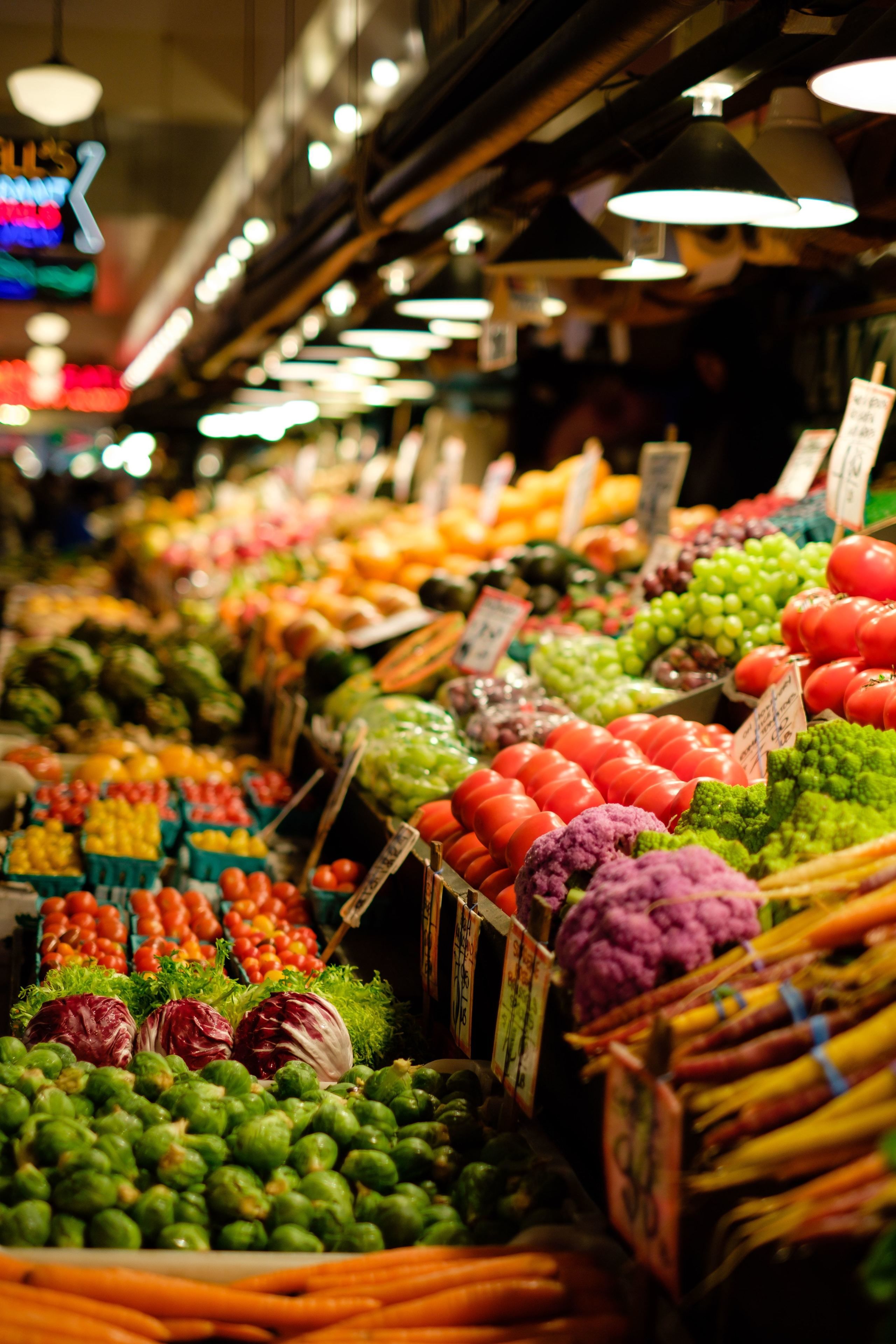 A market with various fruits and vegetables on display.
