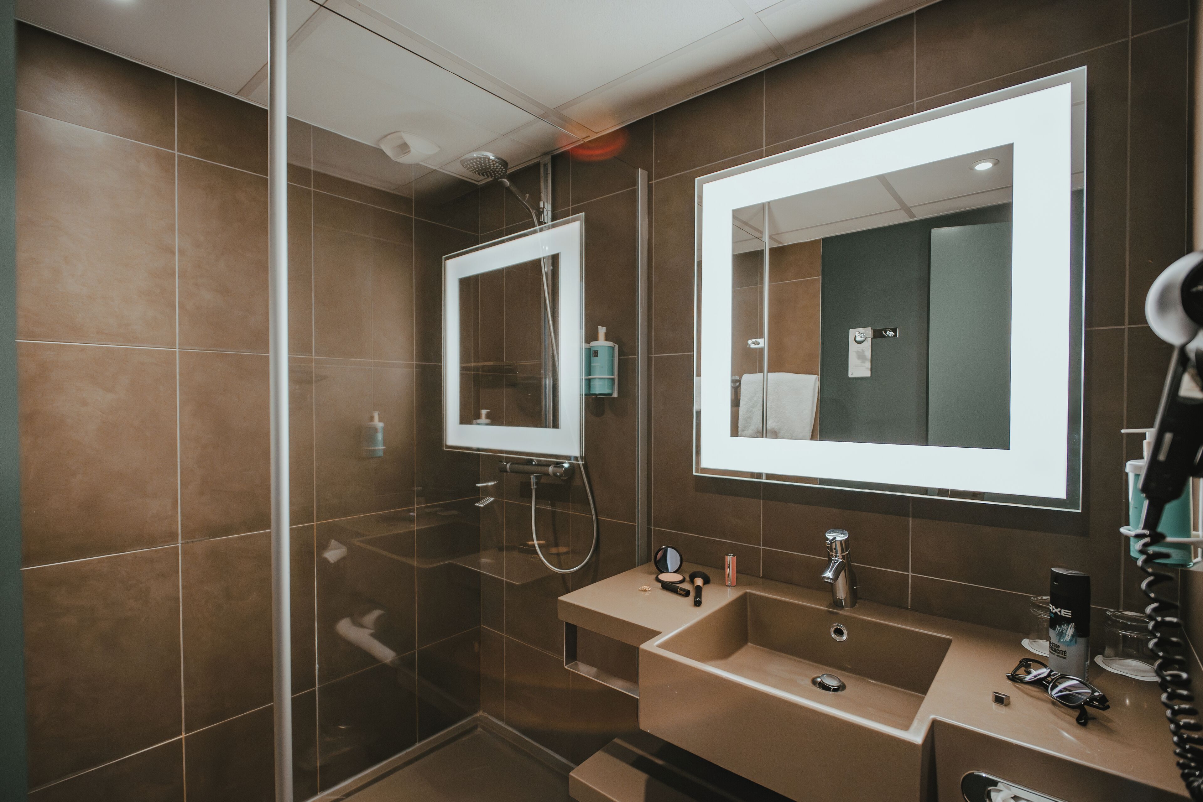 eco-friendly toiletries, hair dryer, towels