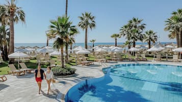 Indoor pool, outdoor pool, pool umbrellas, pool loungers