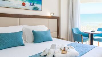 Double or Twin Room, Partial Sea View | Minibar, in-room safe, laptop workspace, blackout drapes