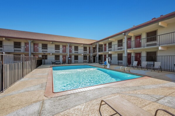 Seasonal outdoor pool, open 10:00 AM to 10 PM, pool umbrellas