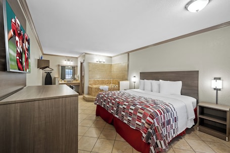 Deluxe Room, 1 King Bed, Non Smoking, Jetted Tub | Desk, laptop workspace, iron/ironing board, free cribs/infant beds. Red Roof Inn College Station