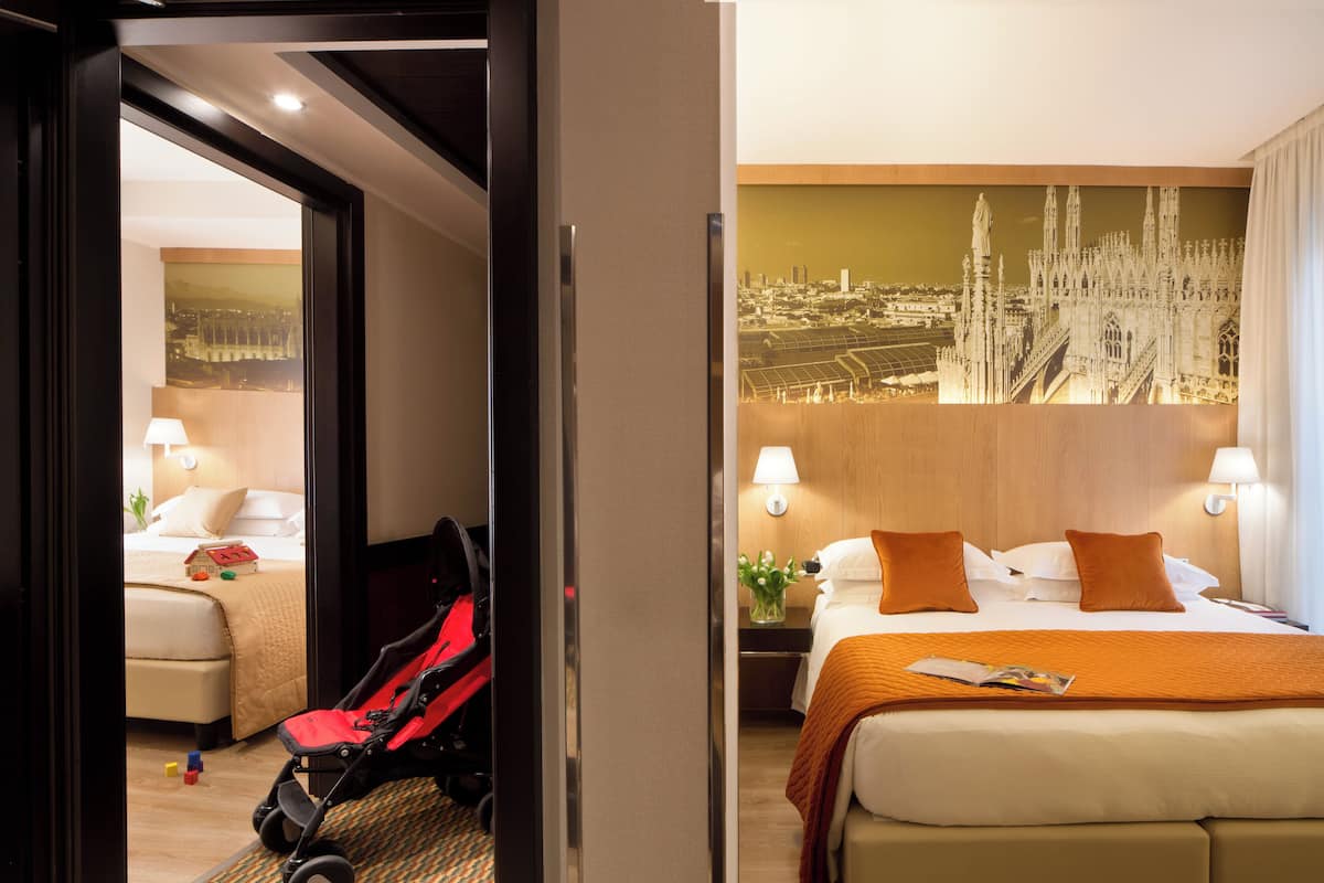Family Room, Multiple Beds | Minibar, in-room safe, desk, blackout drapes