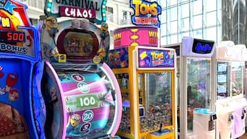 Experience the excitement of classic arcade games in a spacious, well-lit setting.