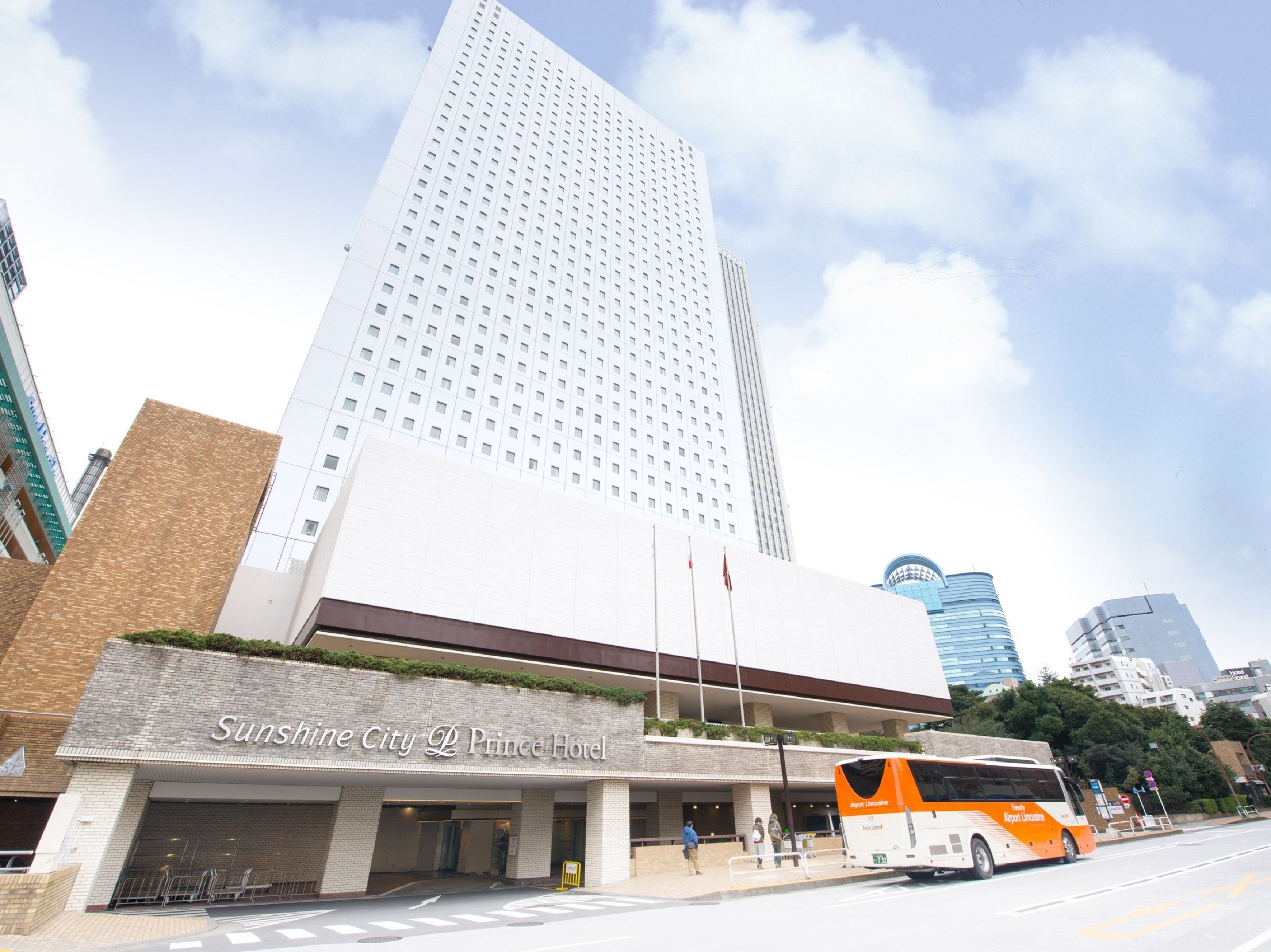 A hotel with a modern design, featuring a large building with a flat facade and a prominent entrance.