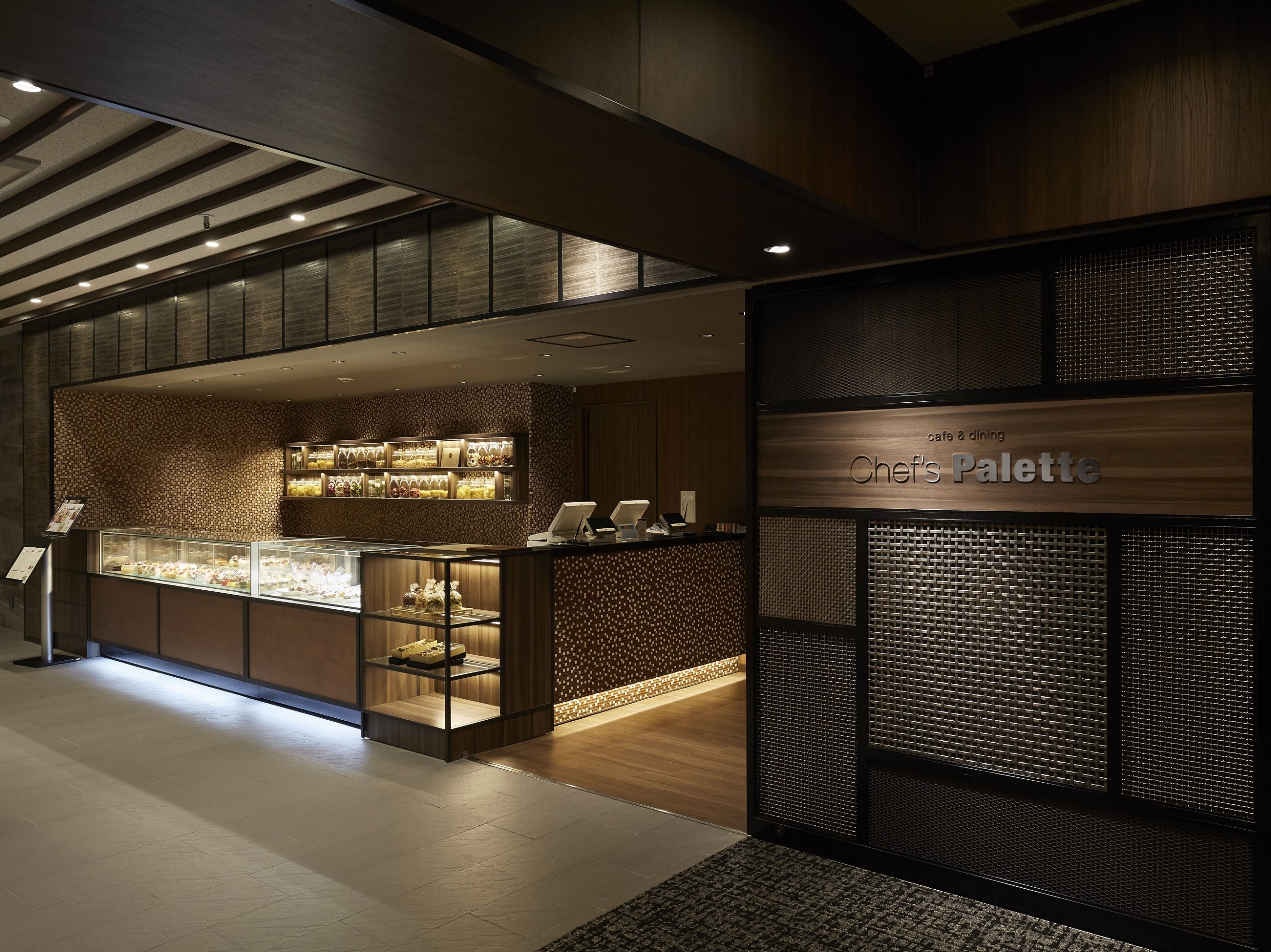Un interior moderno con una sección de café llamada 'Chef's Palette'.