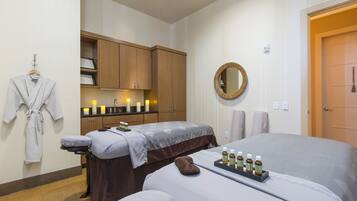 Relax in a serene space with a massage table, robe, and amenities at your fingertips.