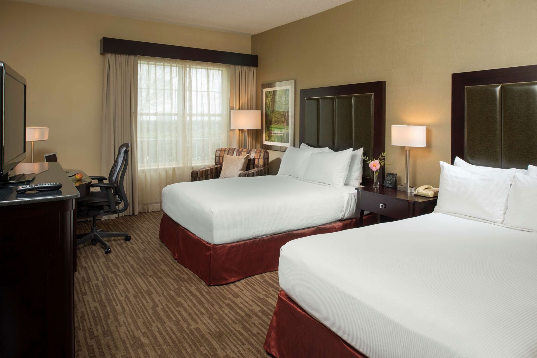 Down duvets, pillow-top beds, in-room safe, desk