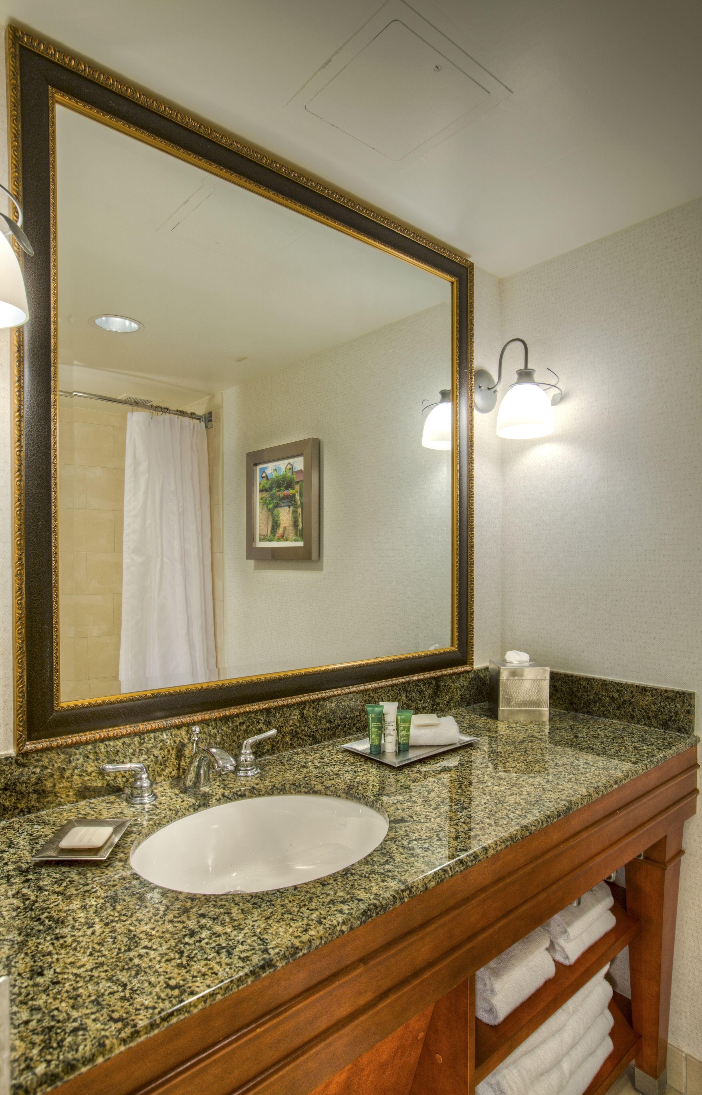 designer toiletries, hair dryer, towels, soap