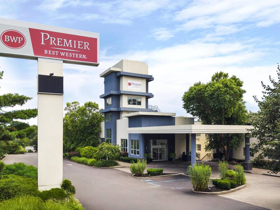 A hotel with a prominent sign reading 'BWP Premier Best Western.'