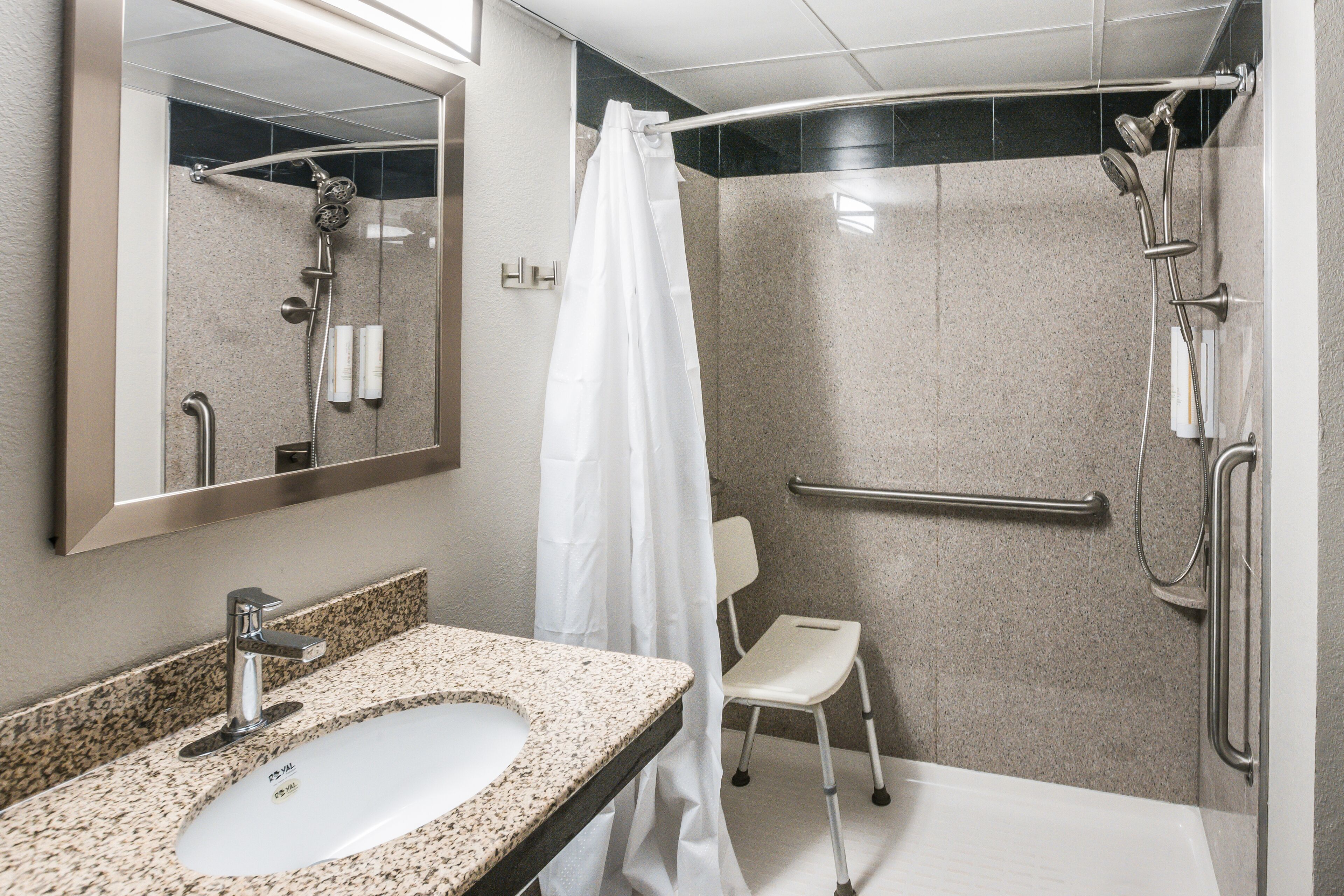 room, 1 king bed, accessible, non smoking | bathroom | combined shower/bathtub, rainfall showerhead, hair dryer, towels