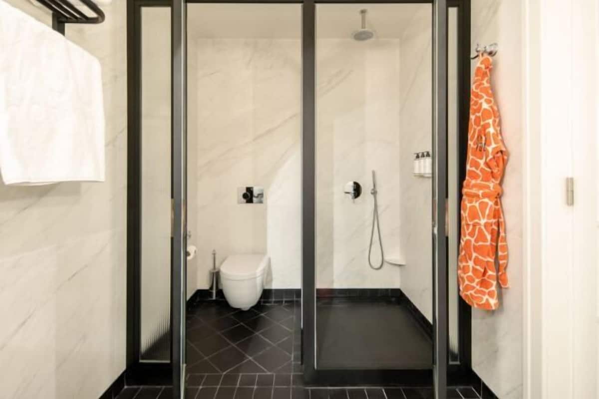 Bathroom | Shower, rainfall showerhead, designer toiletries, hair dryer
