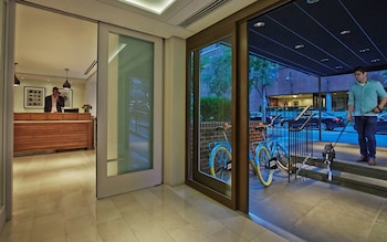 Hotel entrance and lobby at The Gardens Sonesta ES Suites New York