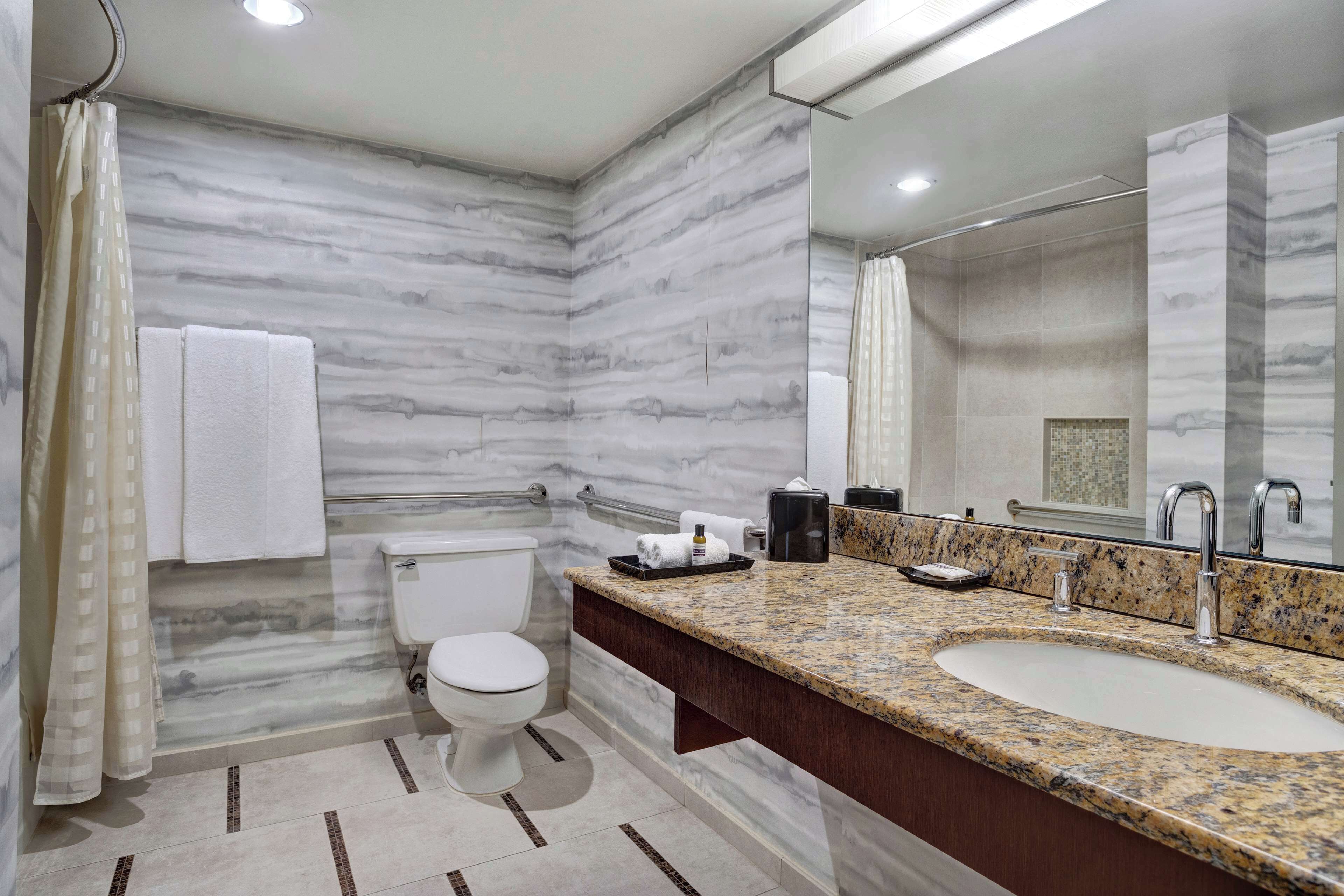 designer toiletries, hair dryer, towels, soap