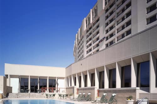 Outdoor pool, open 6:00 AM to 10:00 PM, pool umbrellas, pool loungers
