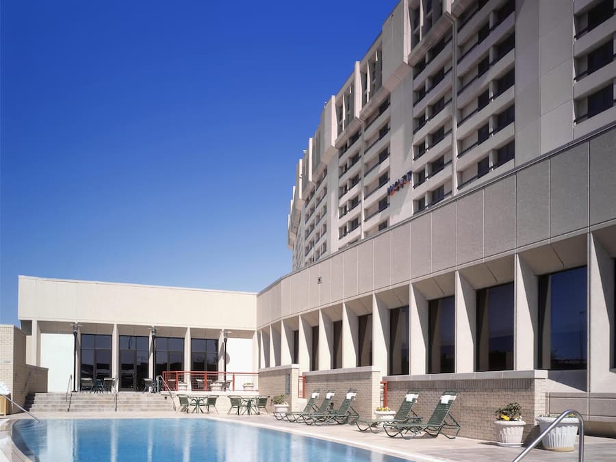 Outdoor pool, open 6:00 AM to 10:00 PM, pool umbrellas, sun loungers
