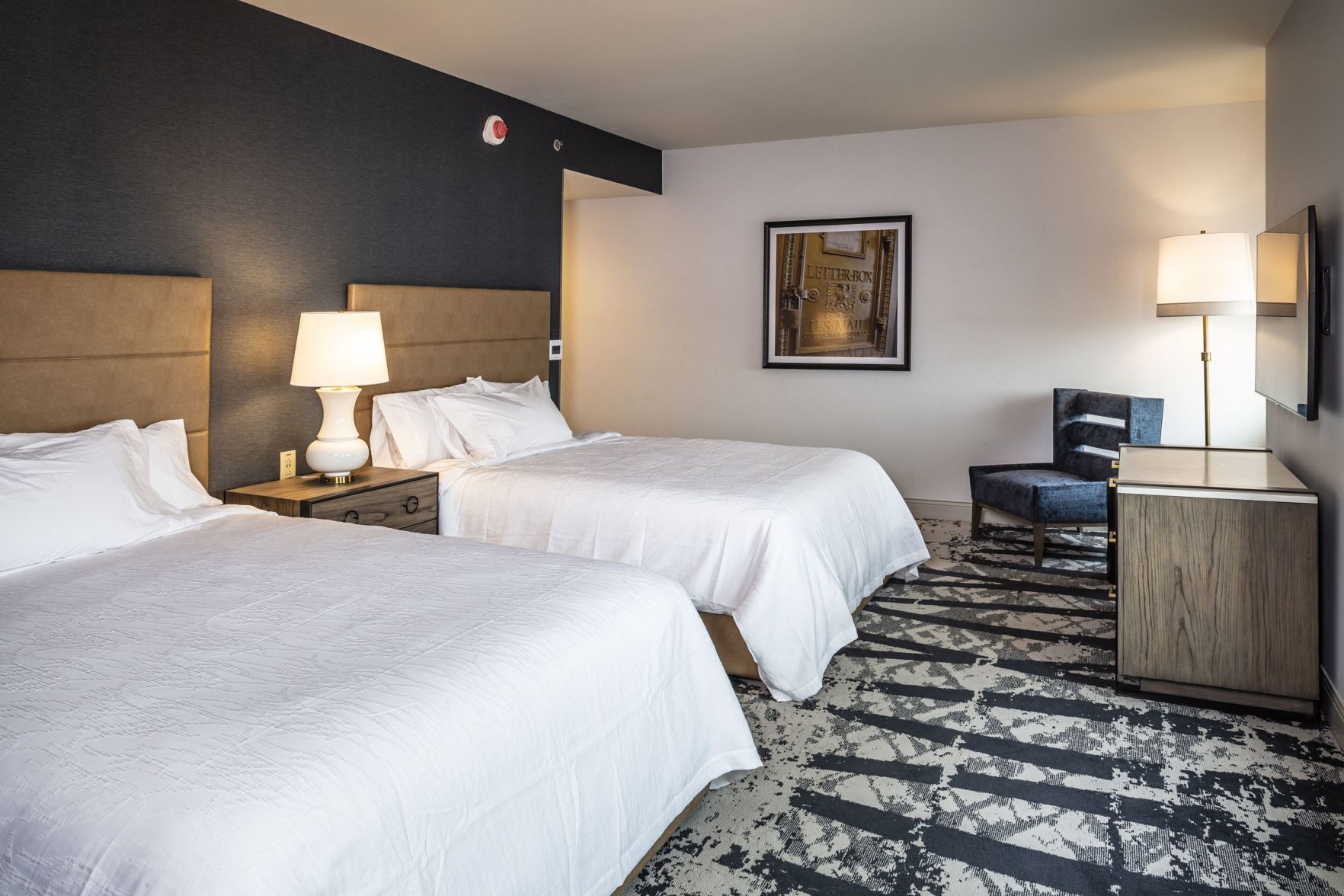 Down comforters, pillowtop beds, in-room safe, desk