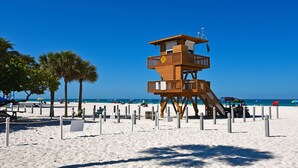 A lifeguard tower on a beach with clear skies. - Magnuson Hotel Bradenton (Bradenton)