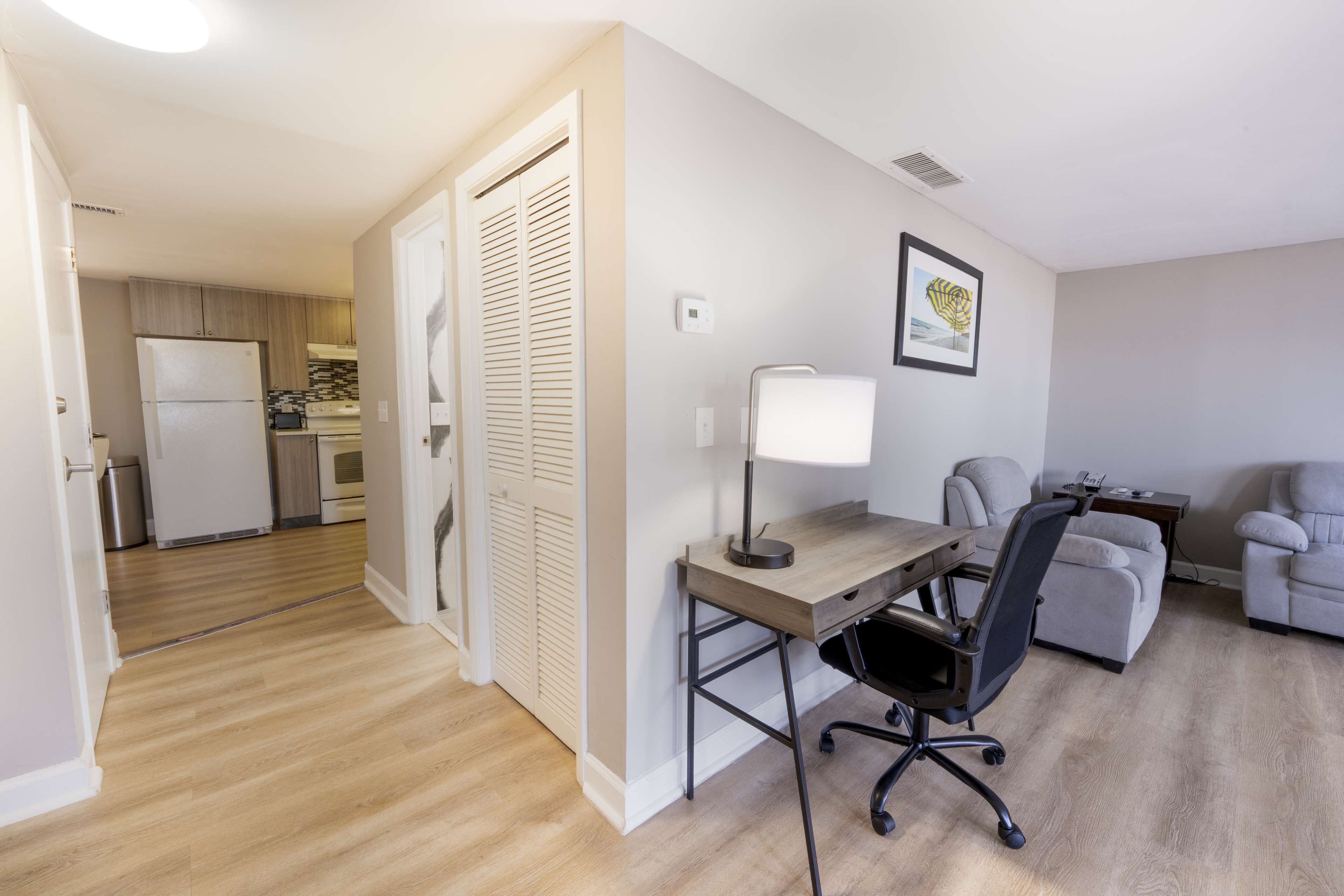 suite, 1 king bed, non smoking, balcony | desk, laptop workspace, iron/ironing board, free wifi