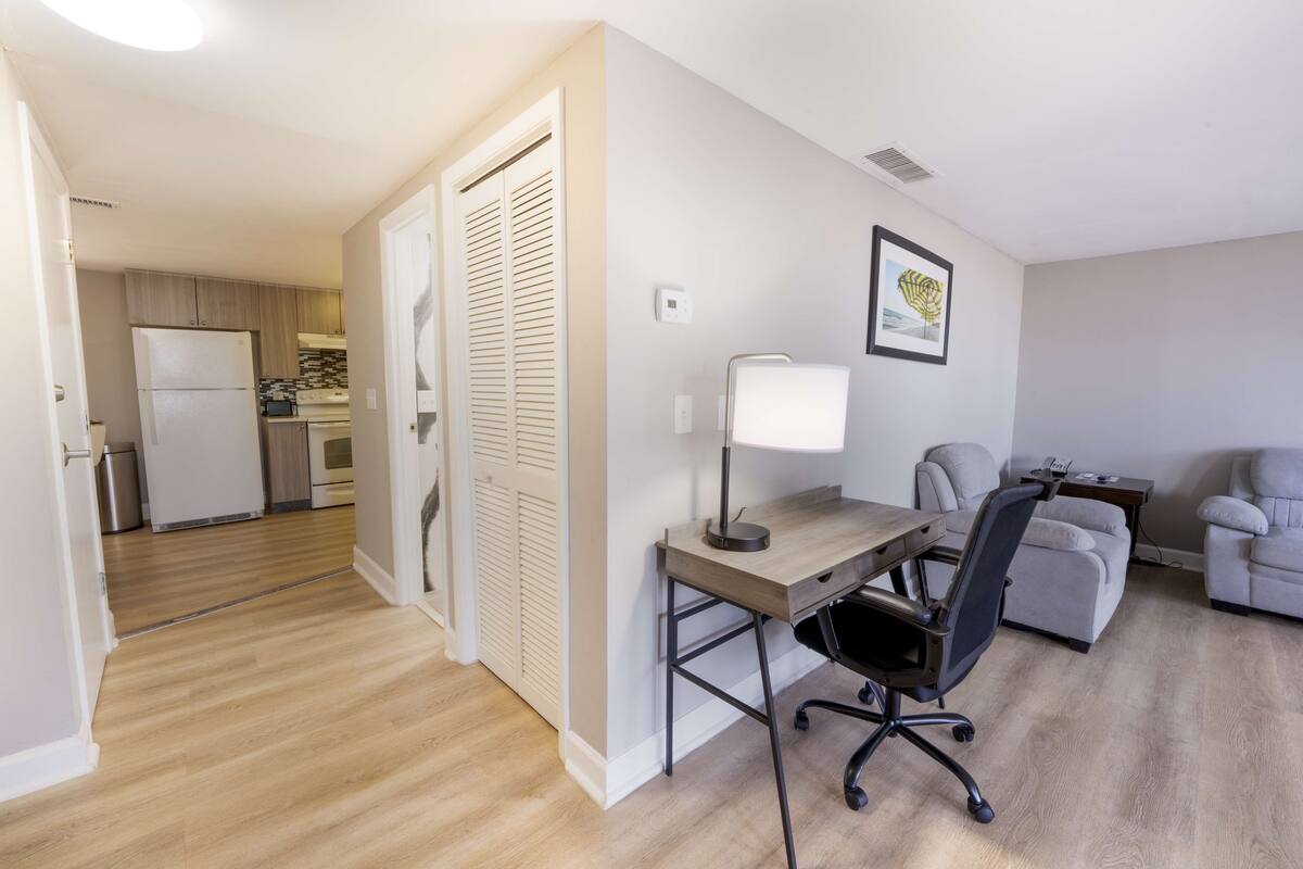 suite, 1 king bed, non smoking, balcony | desk, laptop workspace, iron/ironing board, free wifi