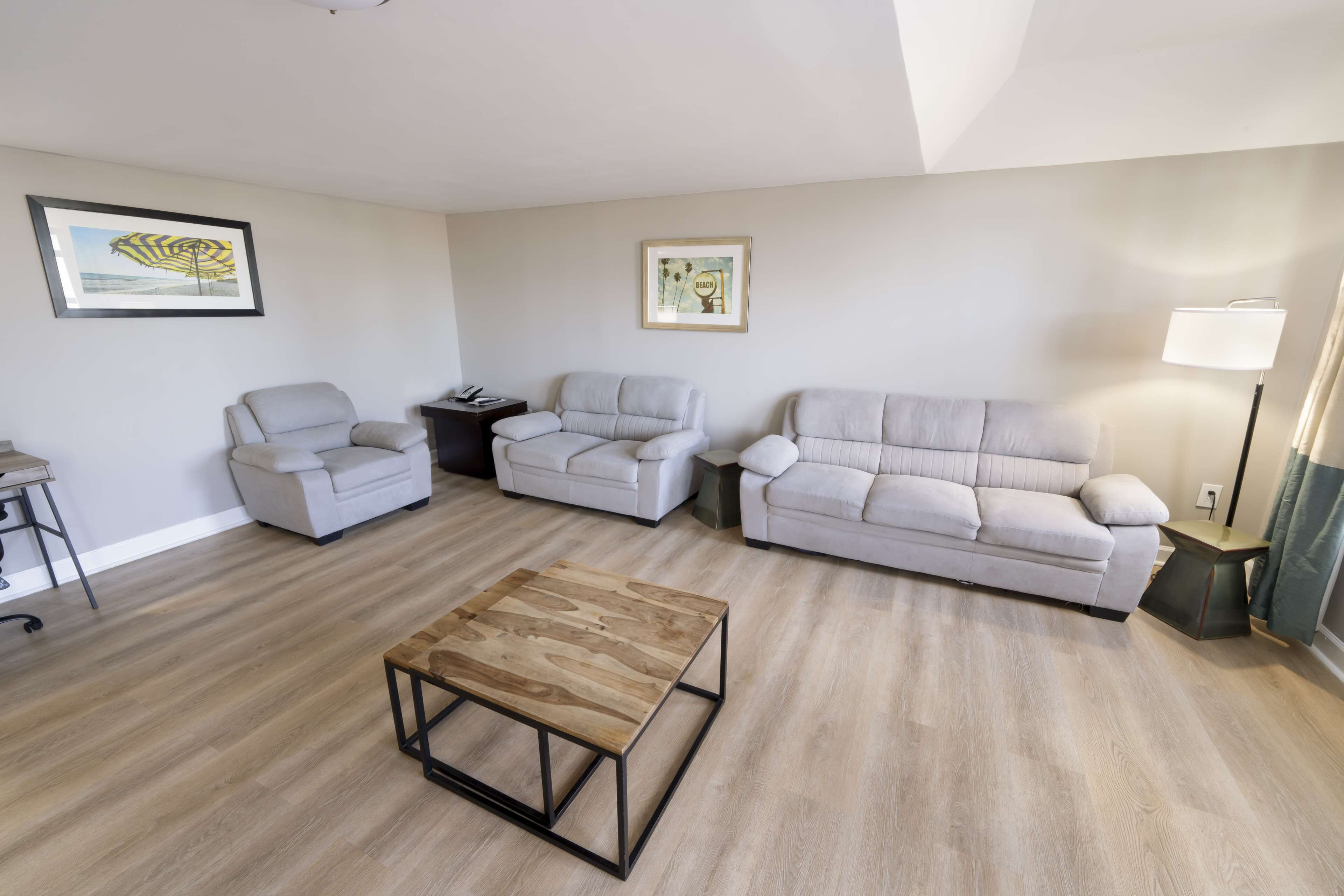 suite, 1 king bed, non smoking, balcony | desk, laptop workspace, iron/ironing board, free wifi