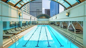 A swimming pool with lounge chairs and a view of tall buildings. - Sheraton Boston, a Marriott Hotel (Boston)